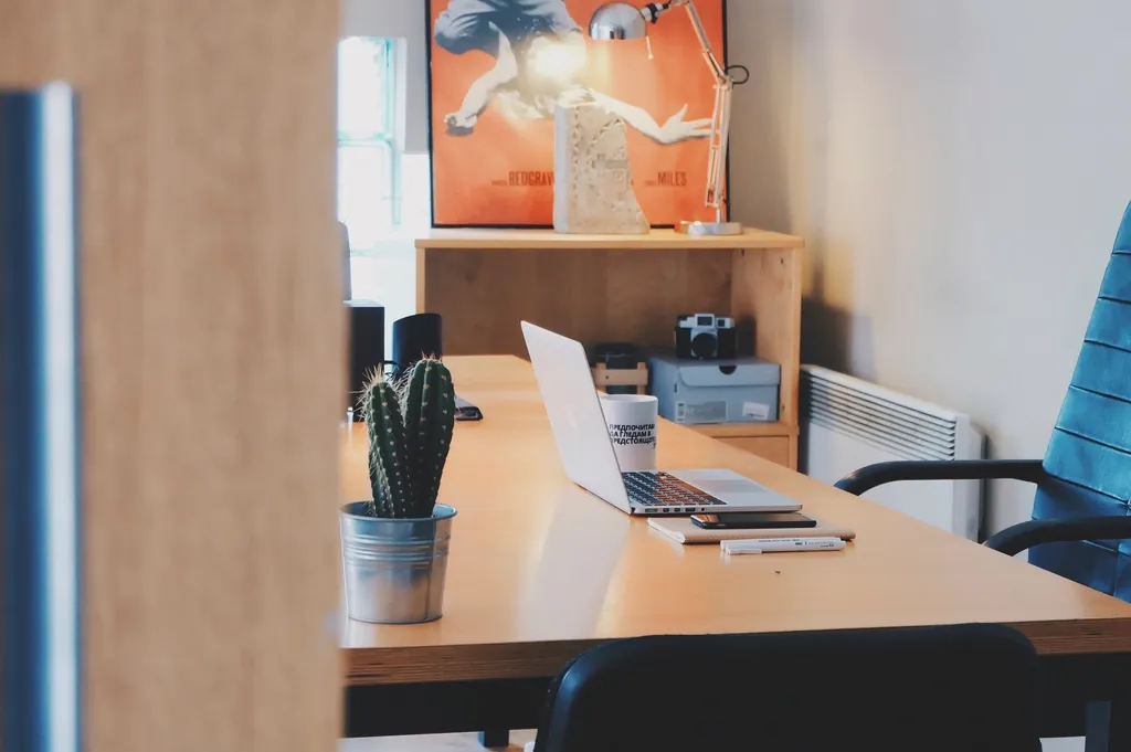 A bright desk with a laptop
